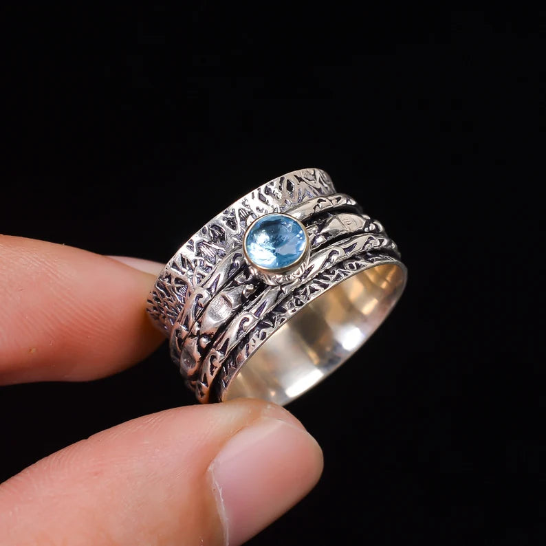 Spinner Blue Topaz Promise Ring