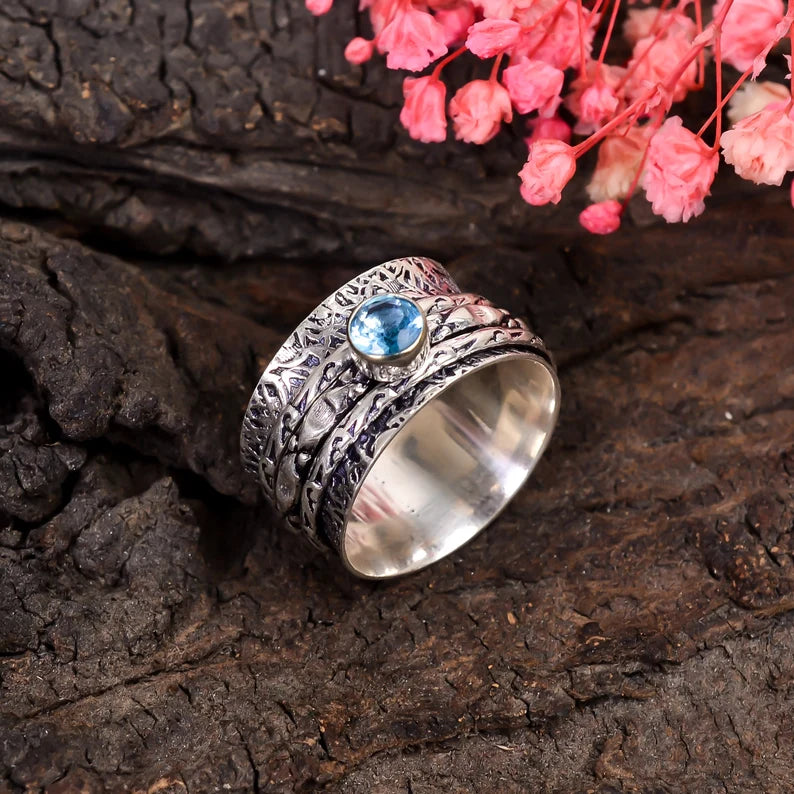 Spinner Blue Topaz Promise Ring