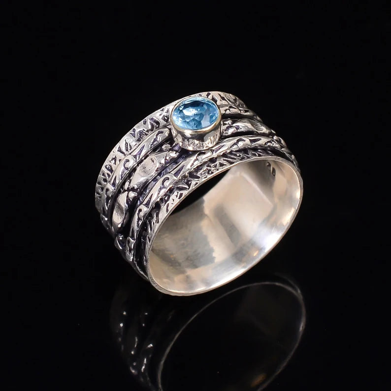 Spinner Blue Topaz Promise Ring