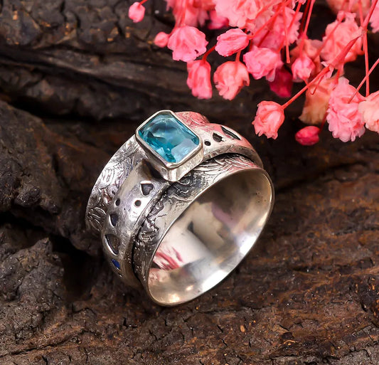 Spinner Blue Topaz Promise Ring