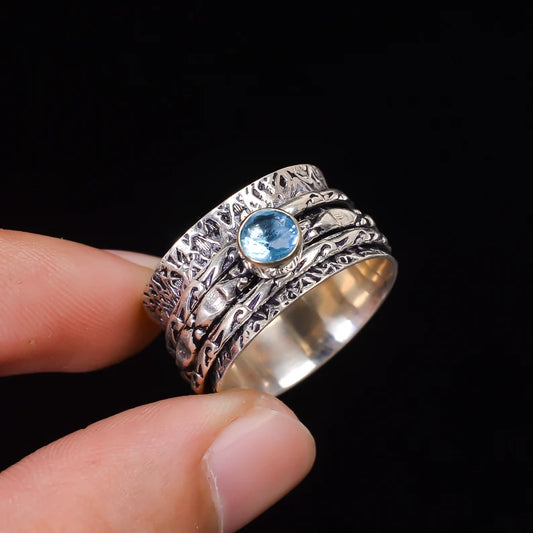 Spinner Blue Topaz Promise Ring